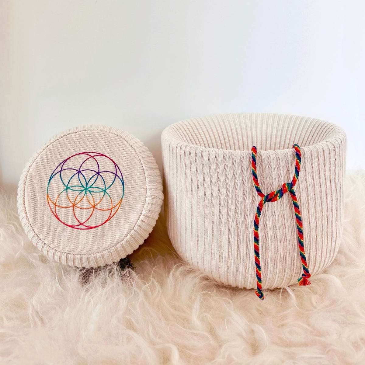 Singing bowl cover by Harmonic Life with rainbow flower of life symbol and signature chakra drawstring closure