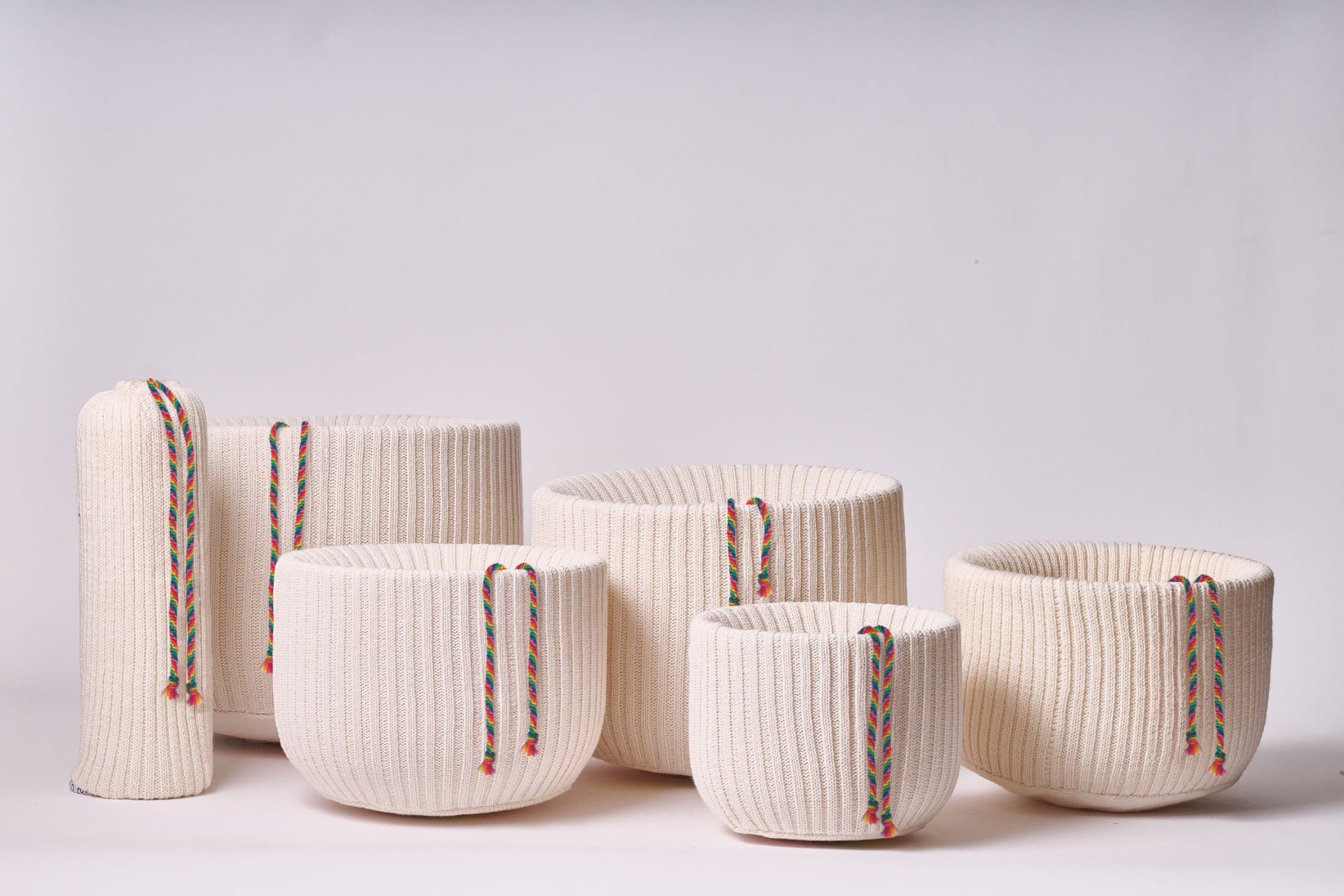 Harmonic Life organic cotton singing bowl covers in all six sizes with chakra drawstrings protecting singing bowls